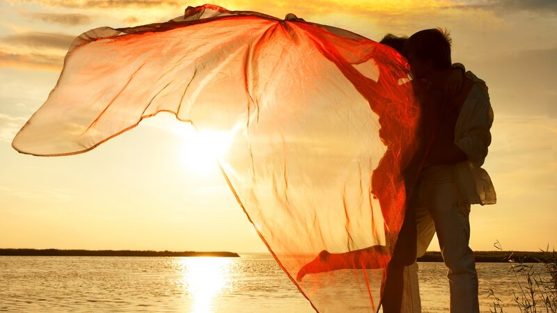 Couple Embracing at Sunset — Orange, Romantic, Photograph