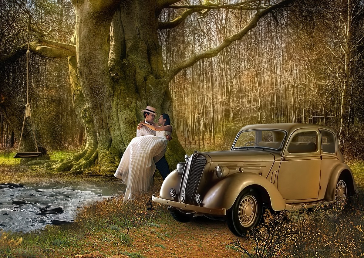 Couple embracing by a vintage car