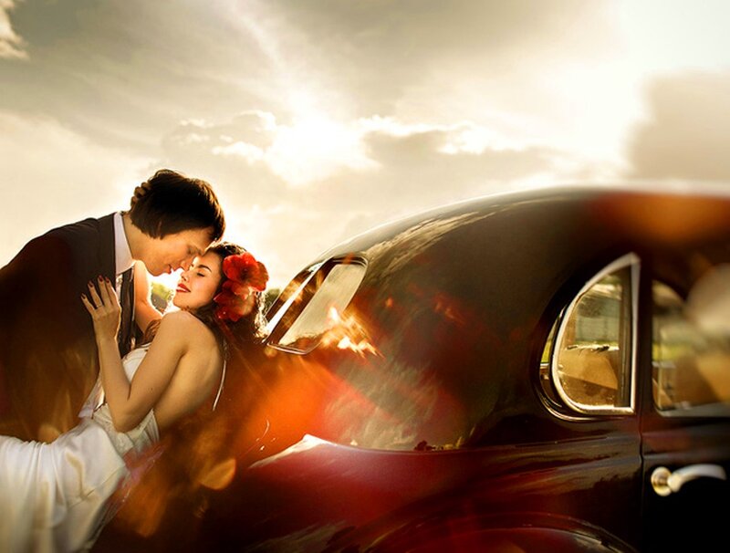 Couple Embracing by Car