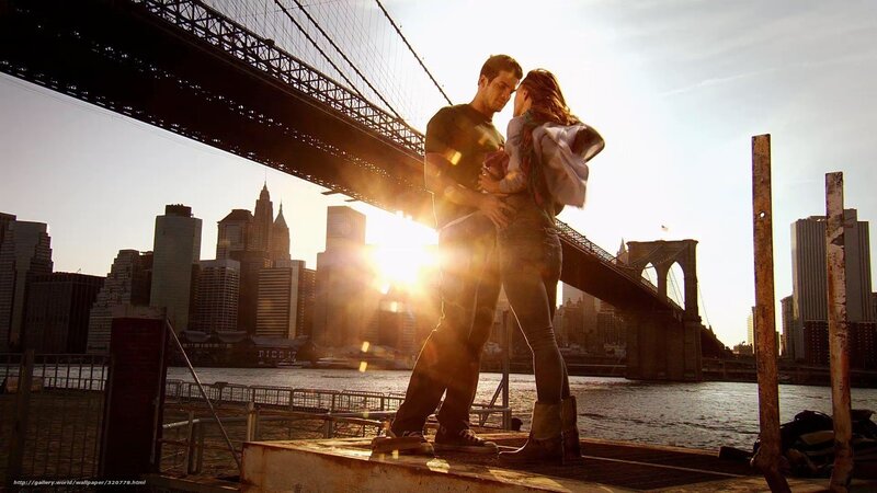 Couple embracing by the bridge