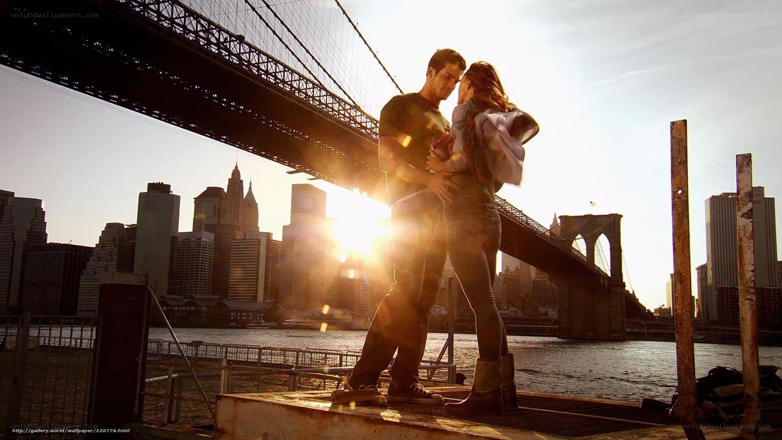 Couple embracing by the bridge