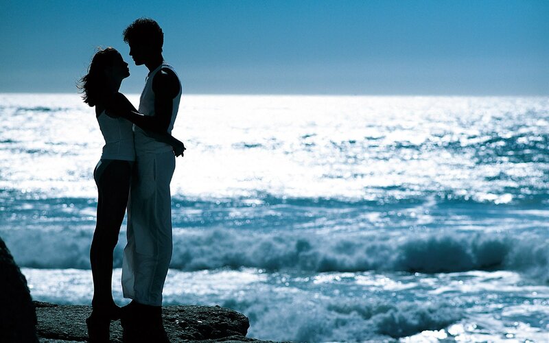 Couple embracing by the sea