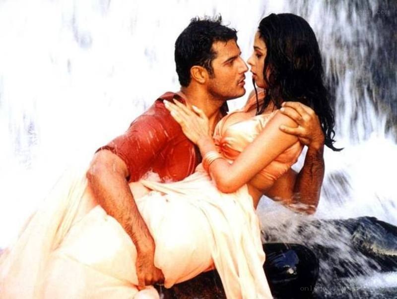 couple embracing by waterfall