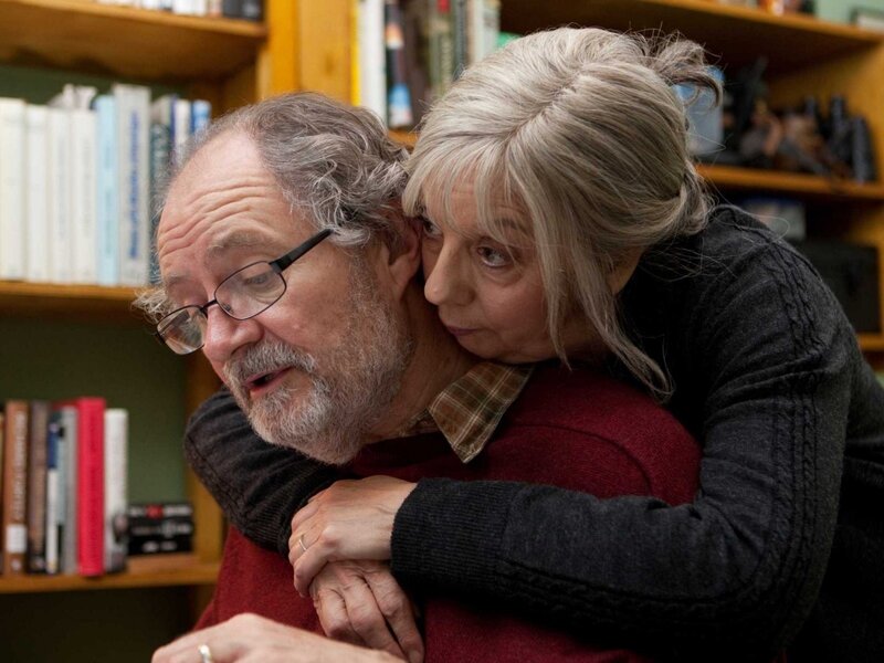 Couple embracing in a library