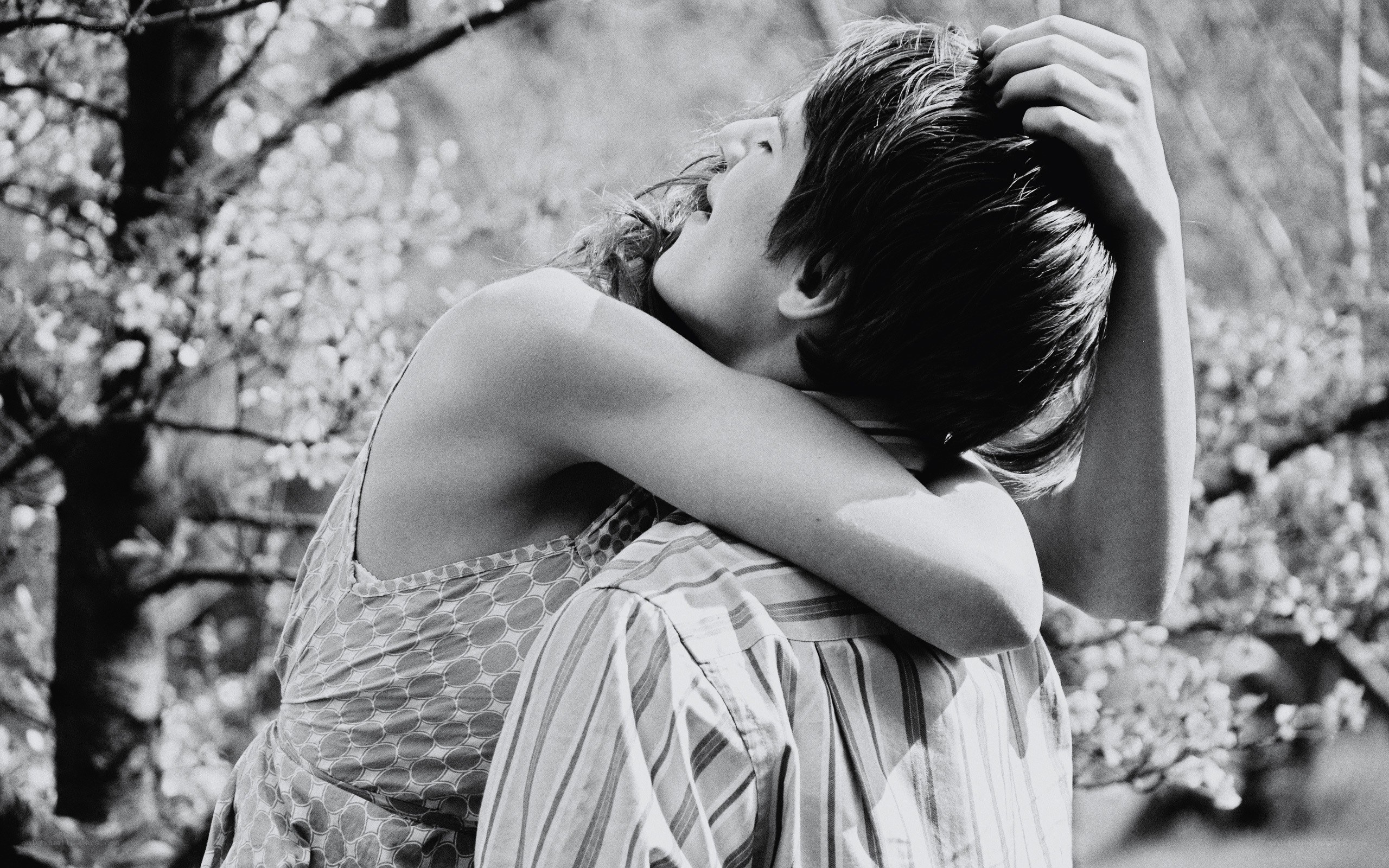 Couple embracing in a park