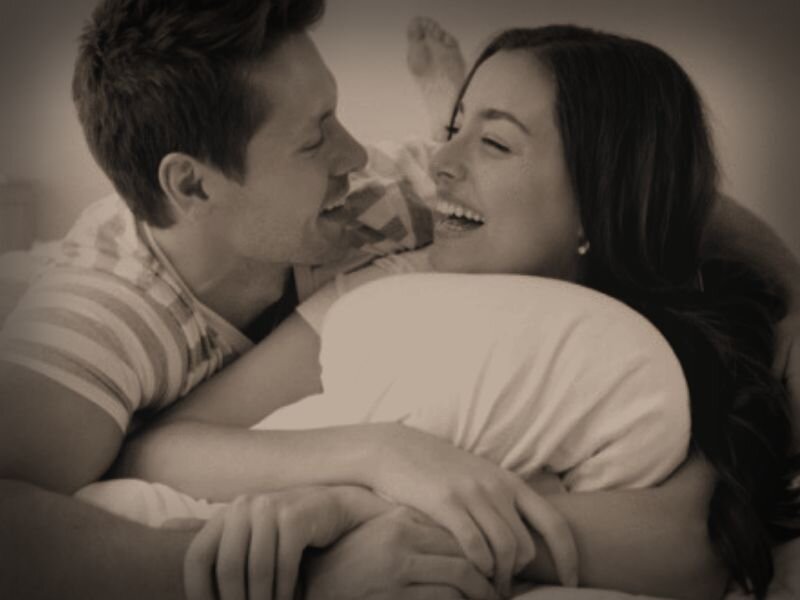 Couple Embracing in Bed — Sepia