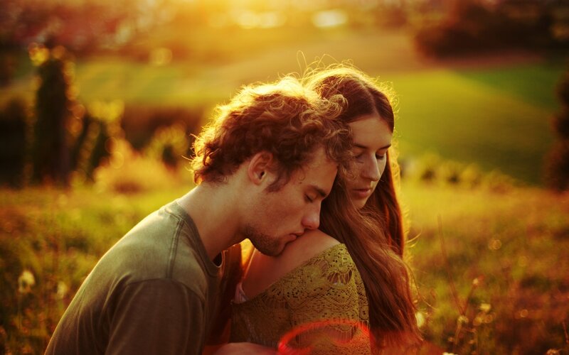Couple Embracing in Field — Golden