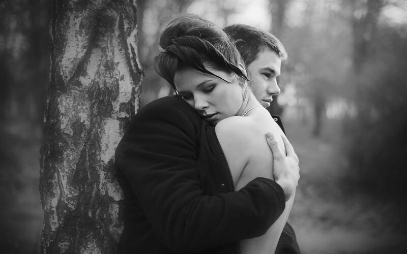 couple embracing in forest