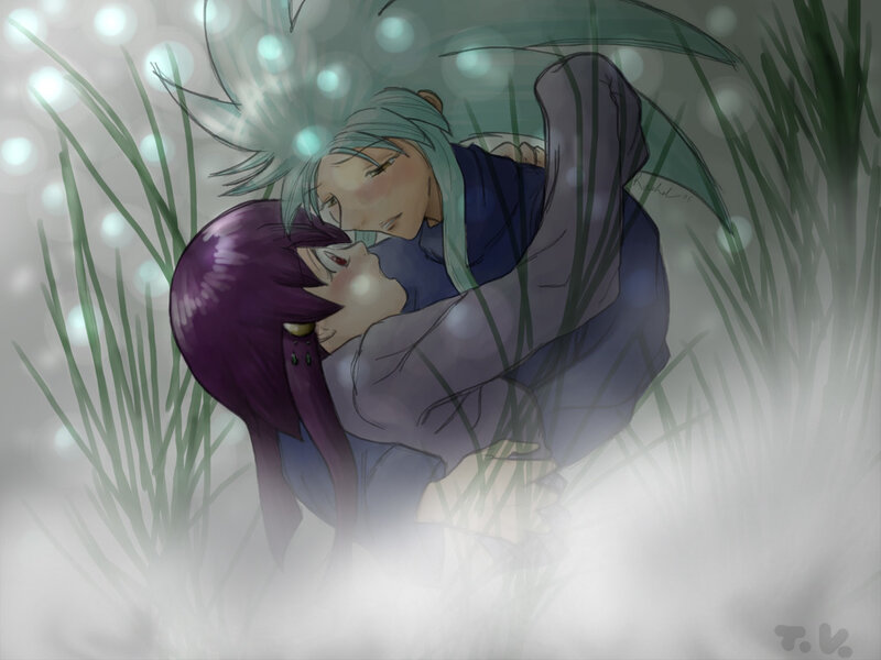 couple embracing in grass