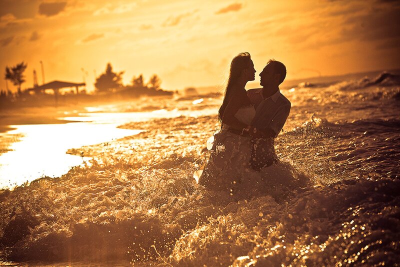 Couple Embracing in Ocean — Orange