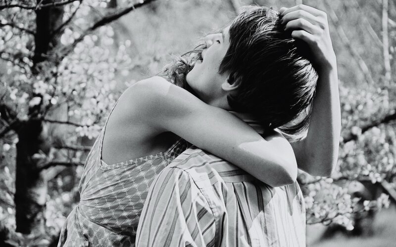 Couple embracing in park