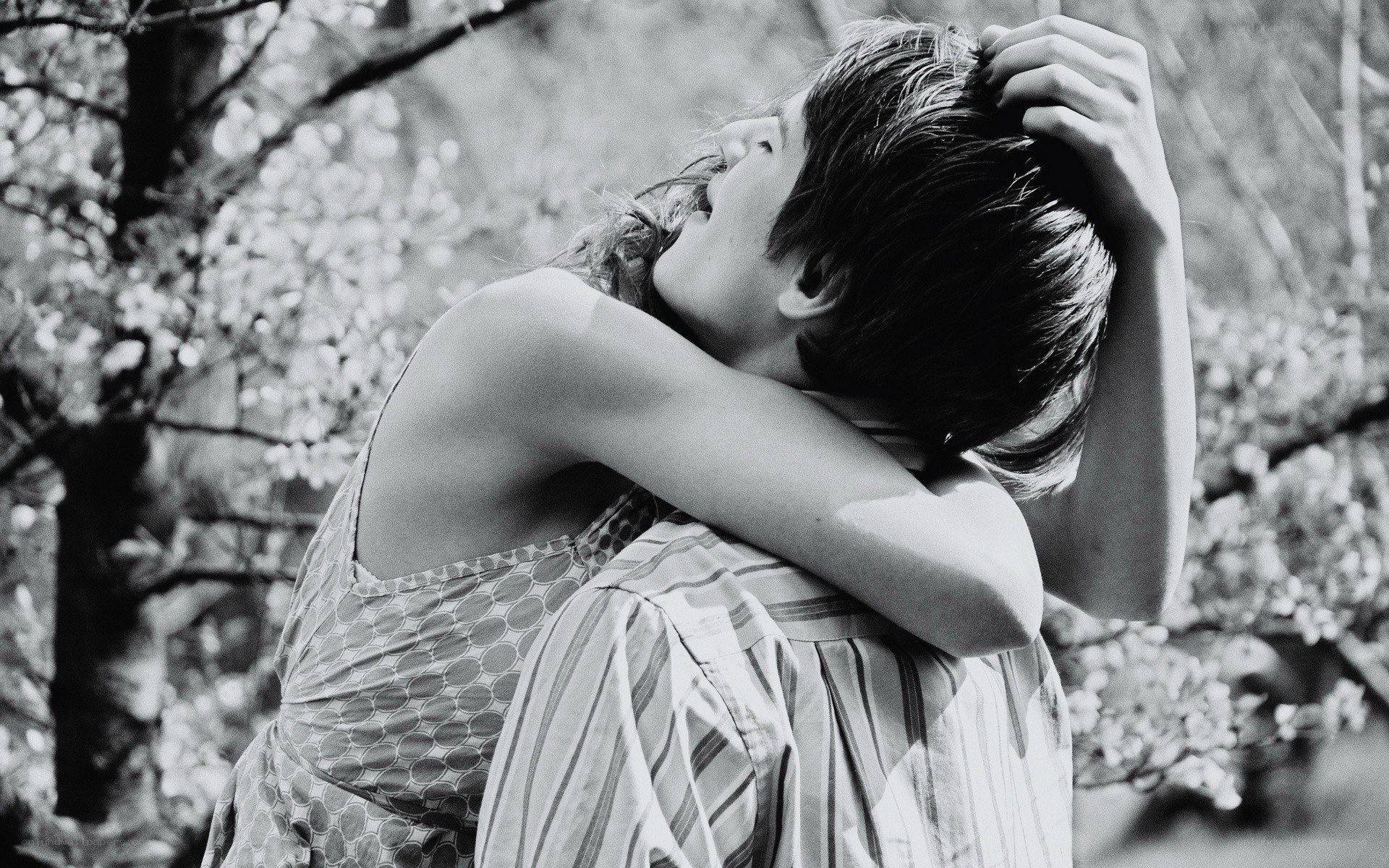 Couple embracing in park