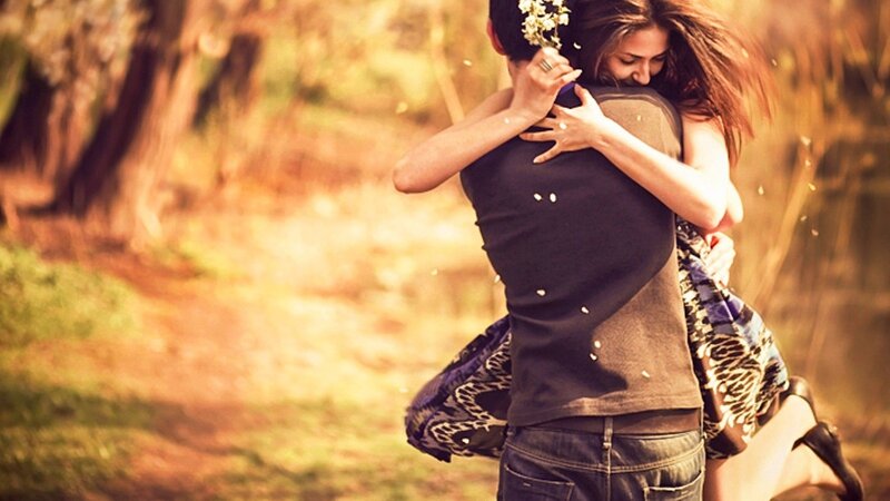 couple embracing in park