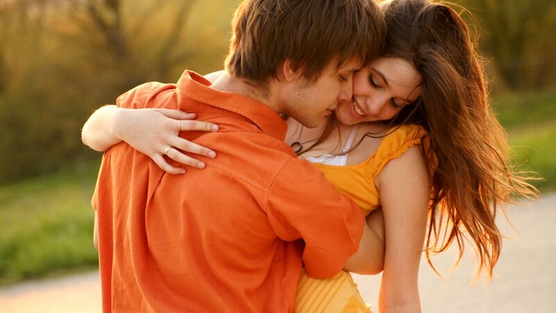 couple embracing in sunset