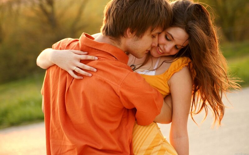 couple embracing in sunset
