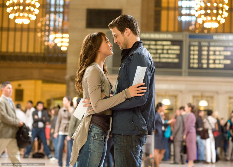 couple embracing in train station