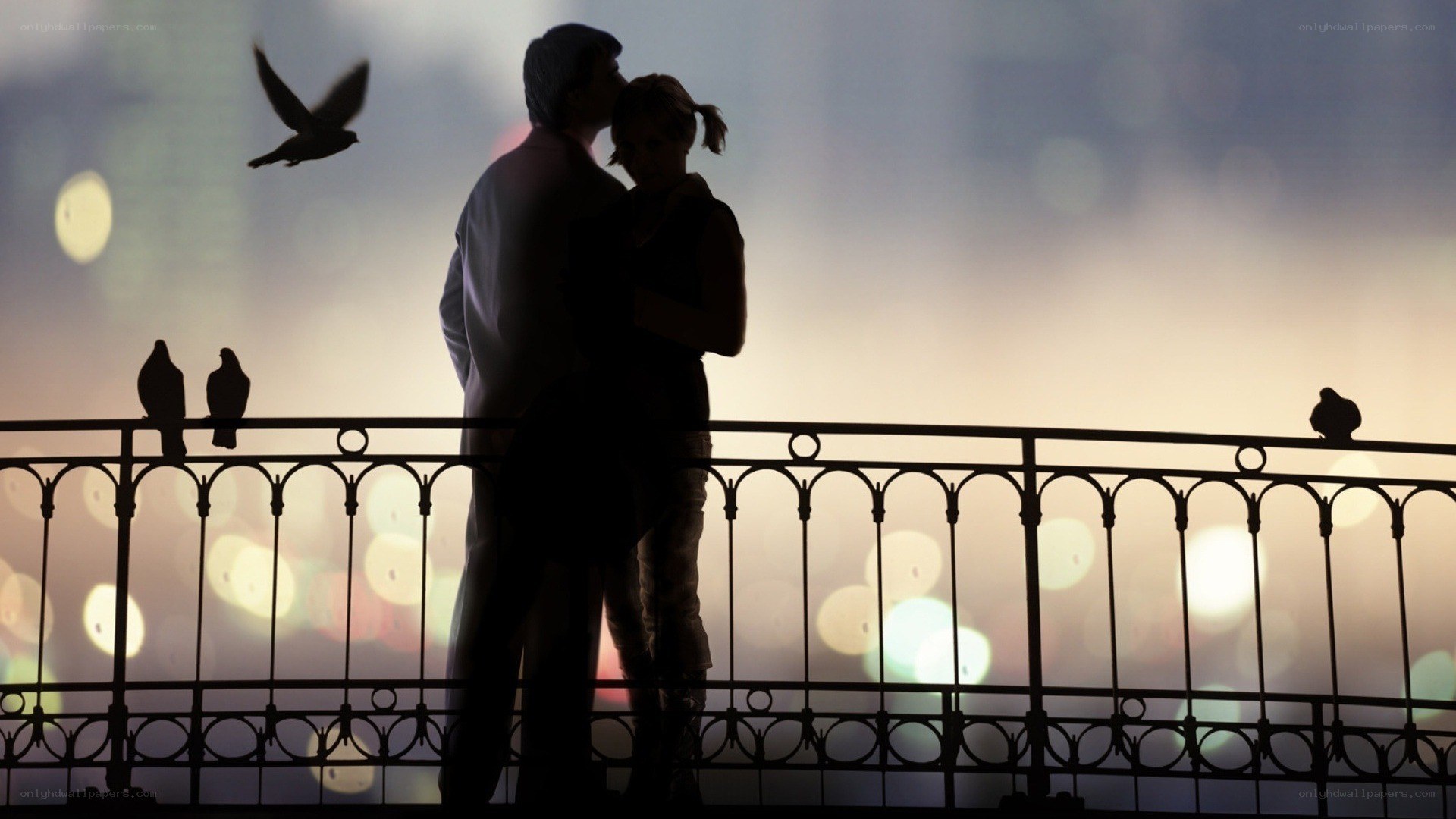Couple embracing on a balcony