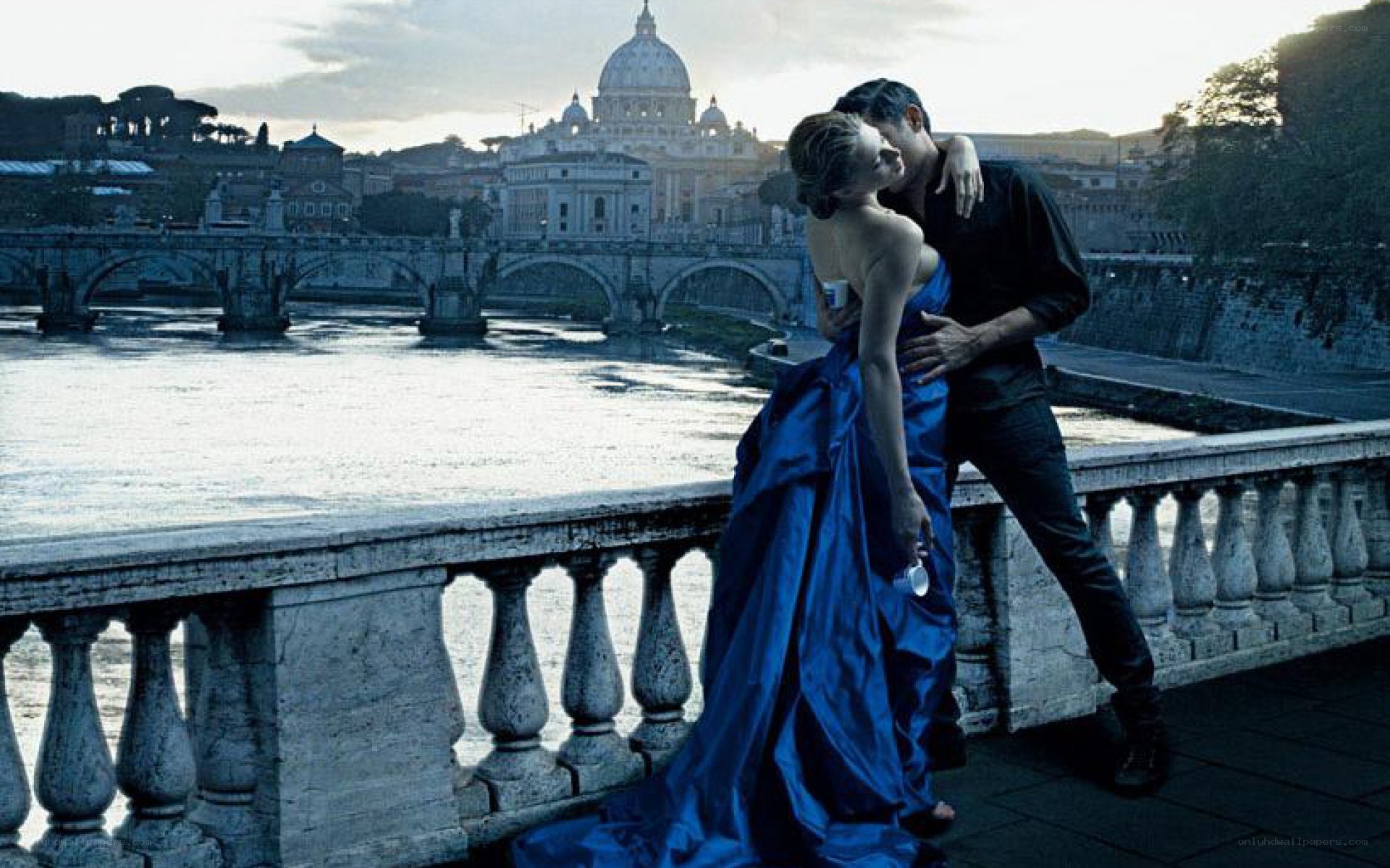 Couple embracing on a bridge
