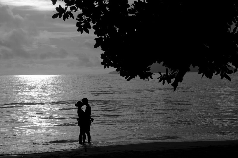 Couple Embracing on Beach — Black, Serene