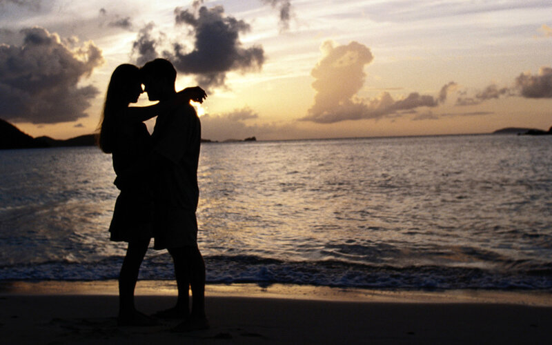 Couple Embracing on Beach — Gold