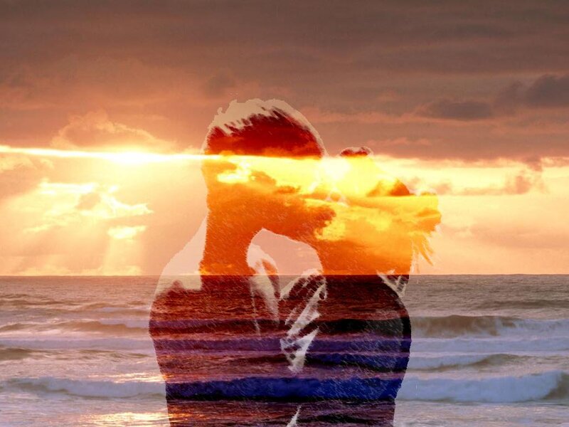 Couple Embracing on Beach — Orange, Dramatic