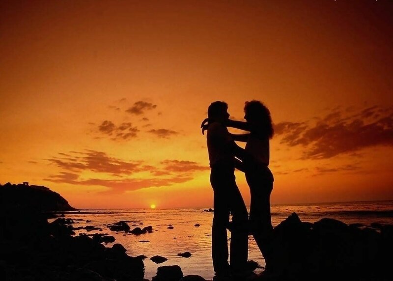Couple Embracing on Beach — Orange, Romantic