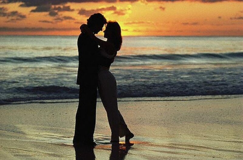 Couple Embracing on Beach — Orange