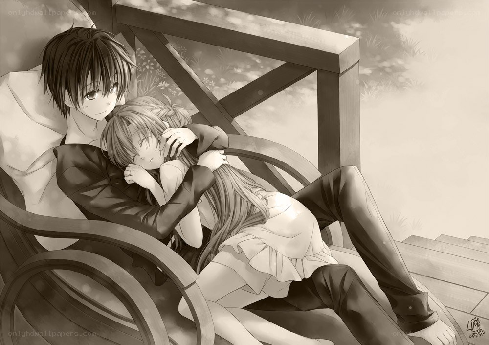 couple embracing on bench
