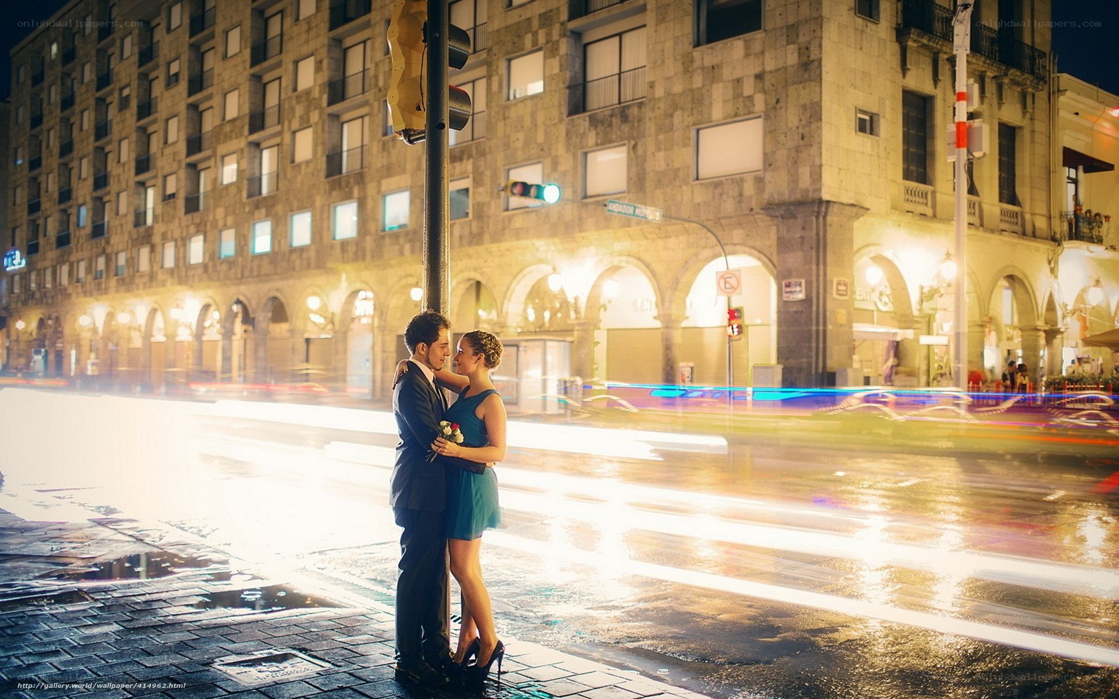 Couple embracing on city street