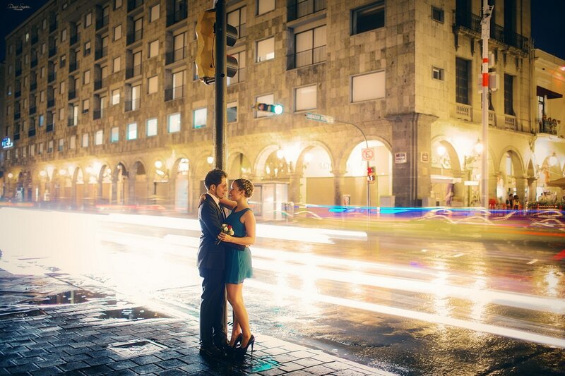 Couple embracing on city street