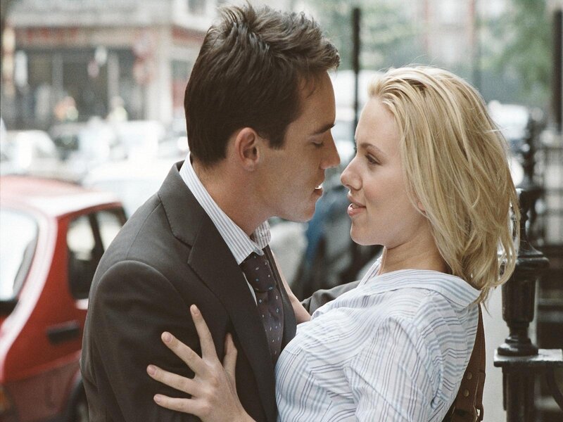 couple embracing on city street