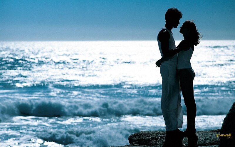 Couple Embracing on Cliff — Blue, Serene, Afternoon