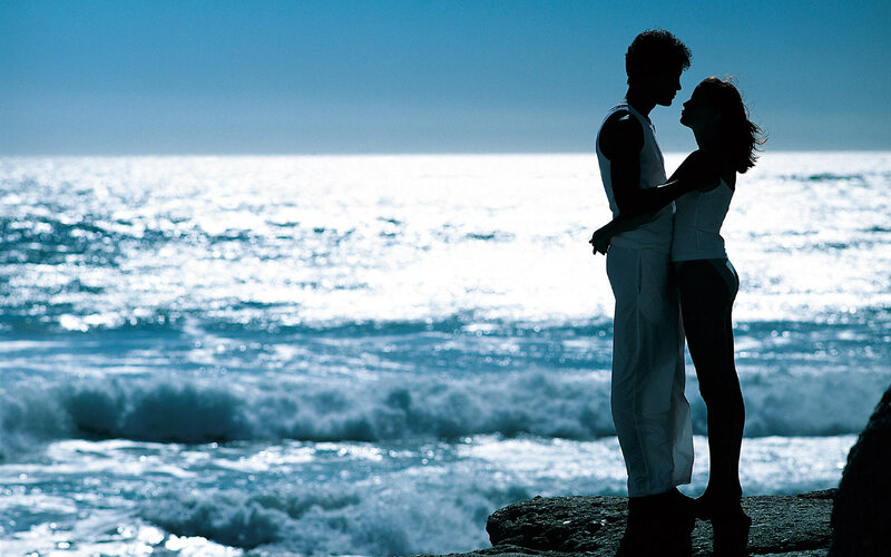 Couple Embracing on Cliff — Blue