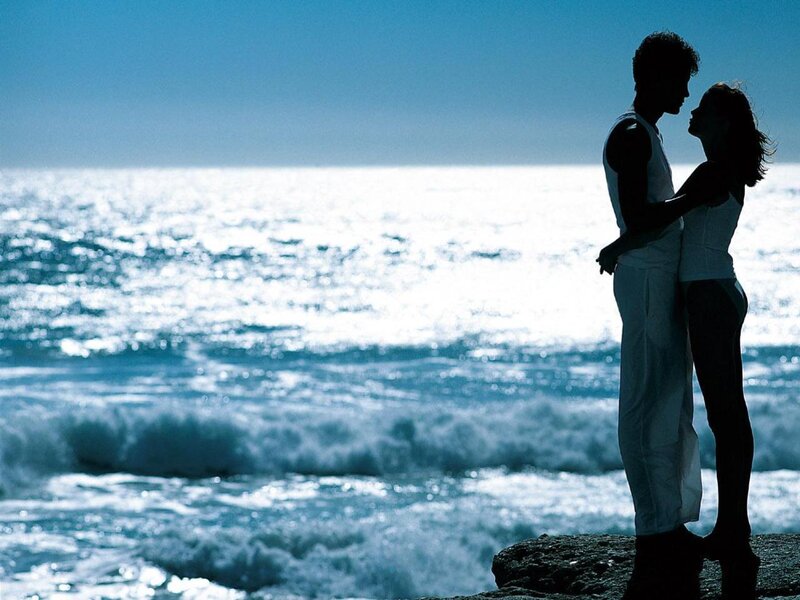 Couple Embracing on Cliff