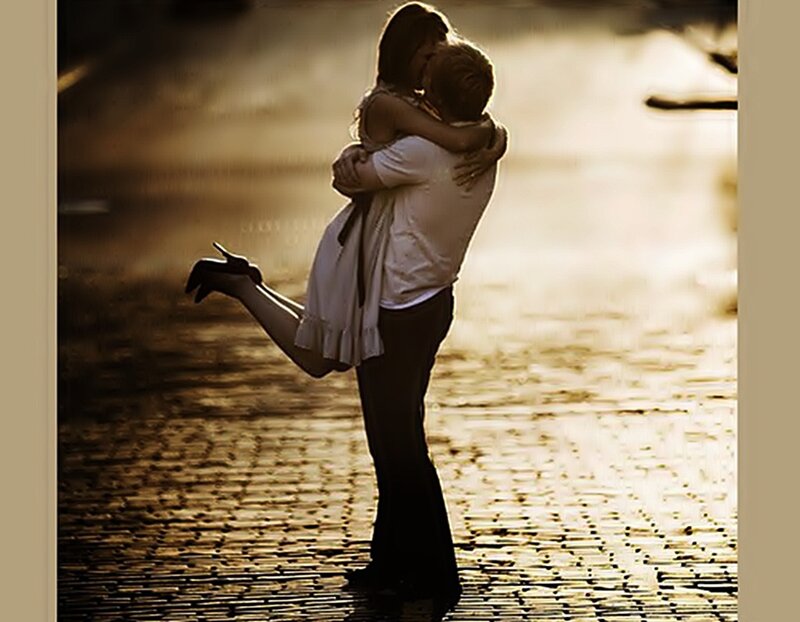Couple Embracing on Cobblestones