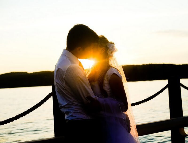 Couple Embracing on Dock