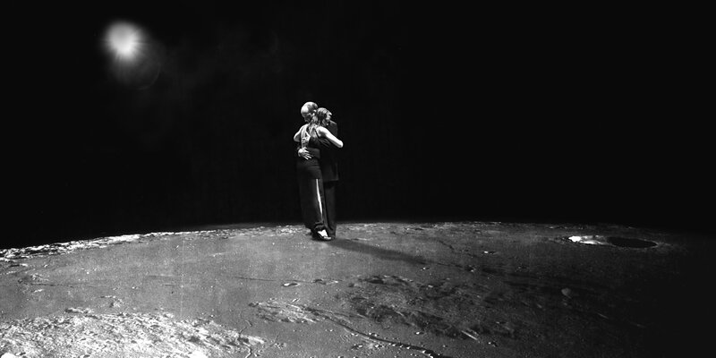 Couple embracing on moon surface