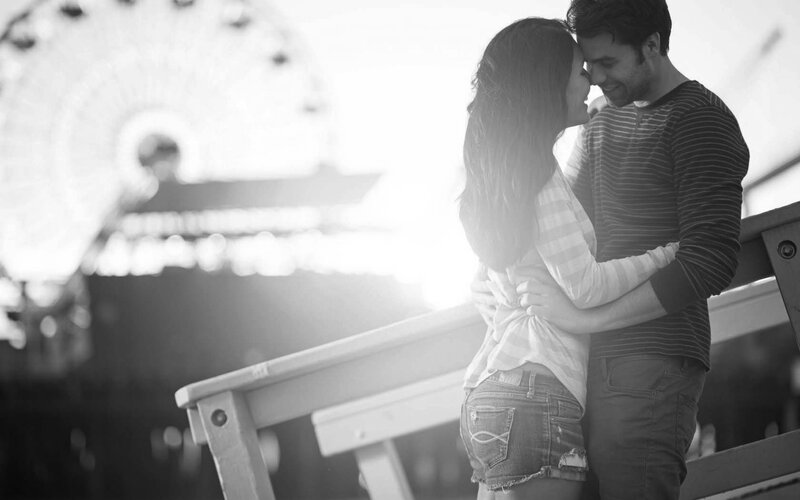 Couple Embracing on Pier — Black, Romantic