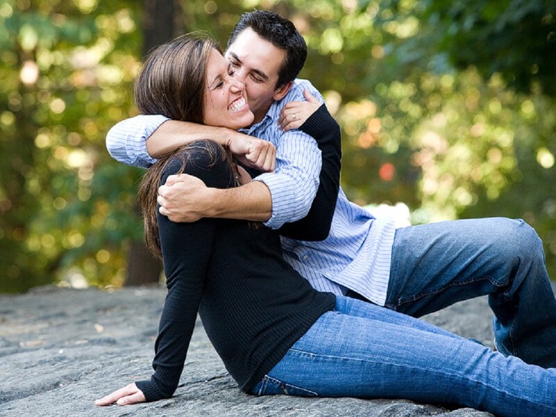Couple Embracing on Rock — Green
