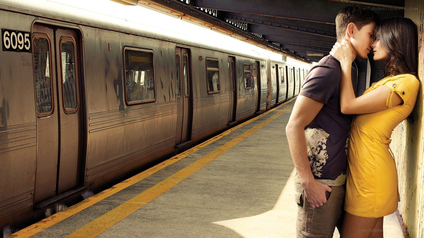 Couple embracing on subway platform