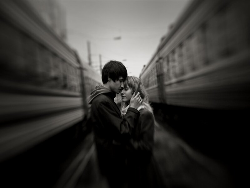 Couple Embracing on Train Platform