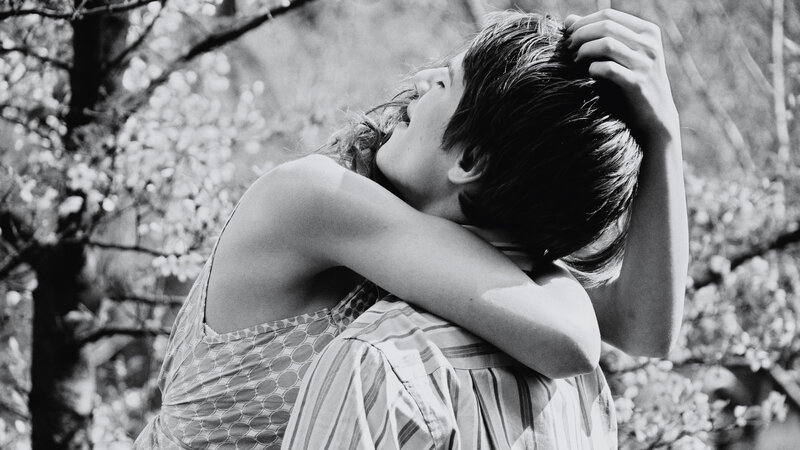 Couple Embracing Outdoors — Black, Intimate, Spring