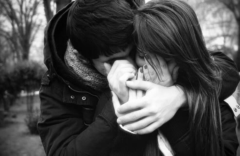 Couple Embracing Outdoors — Black, Somber