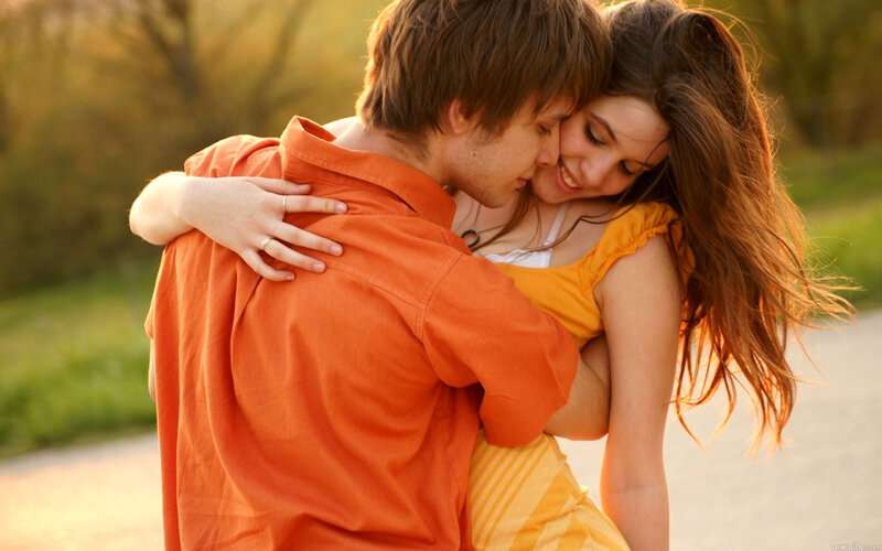 Couple Embracing Outdoors — Orange, Intimate