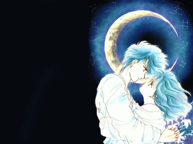 couple embracing under moon