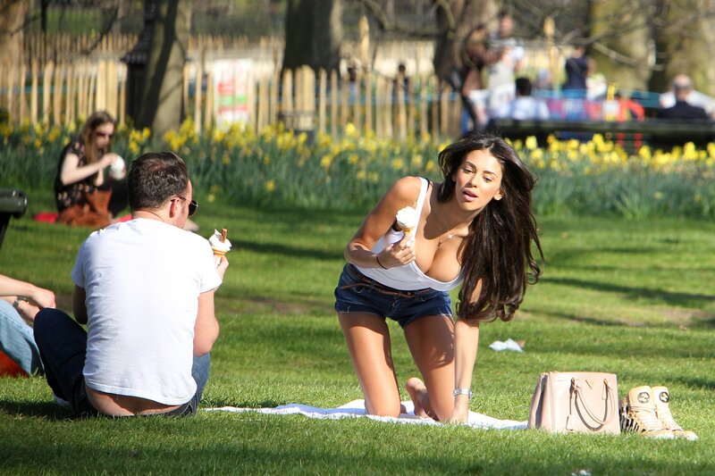 Couple enjoying ice cream in park