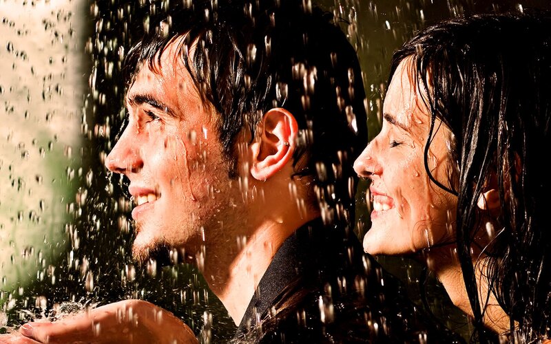 couple enjoying rain shower