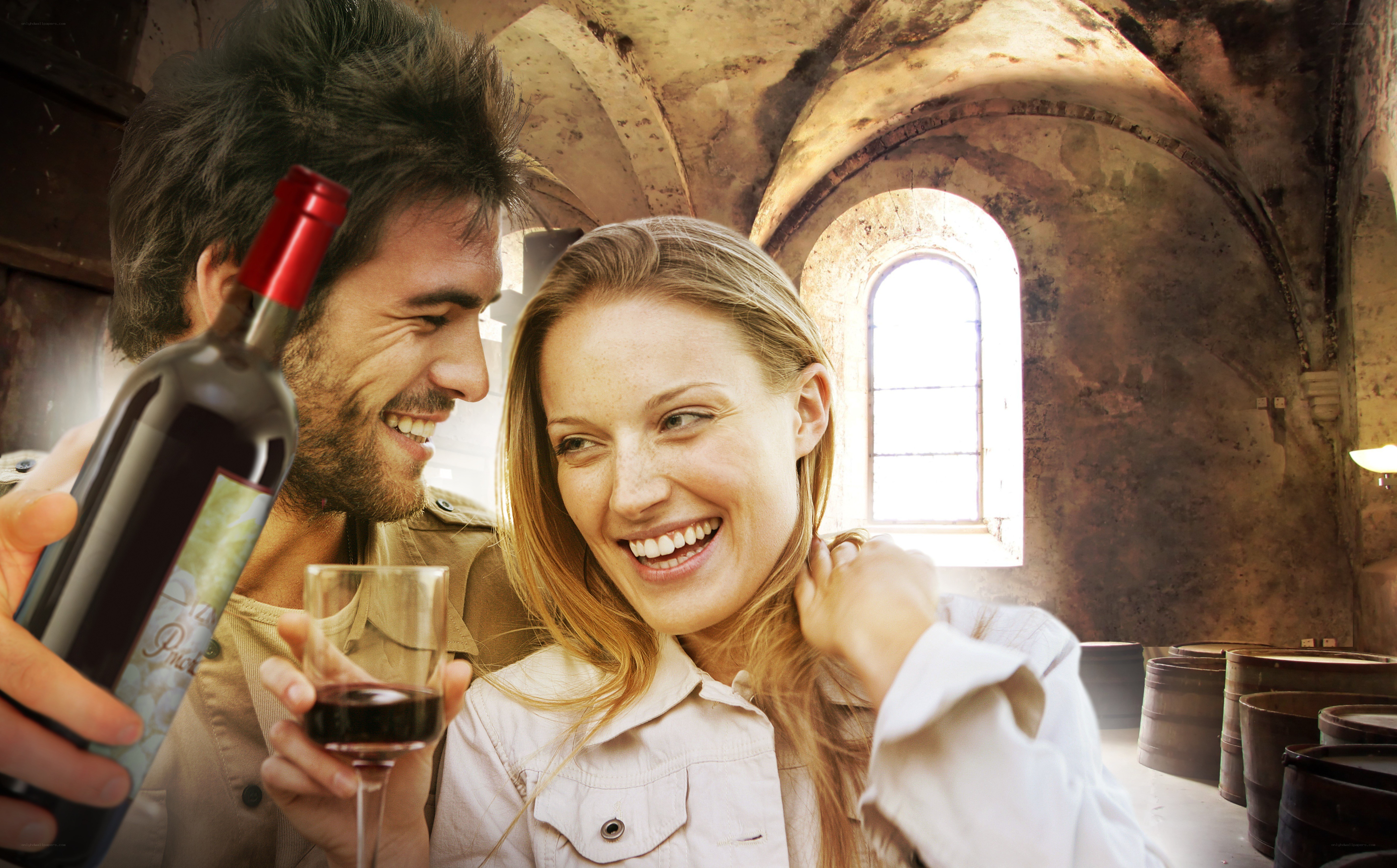 Couple enjoying wine in cellar