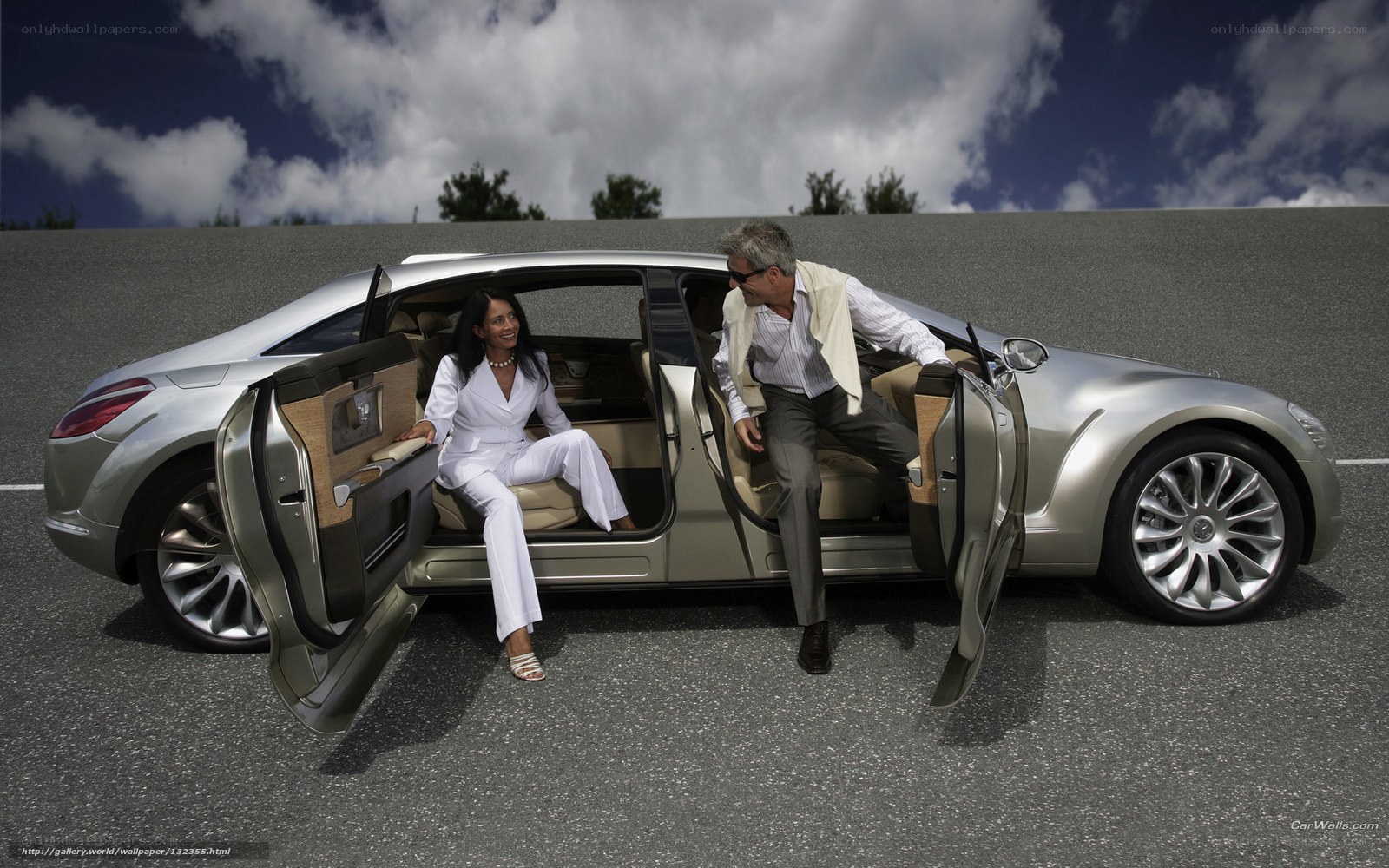 Couple exiting luxury car