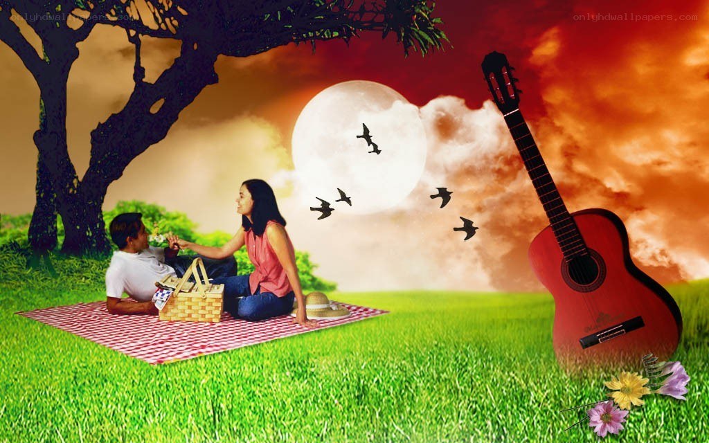 Couple having picnic under moon